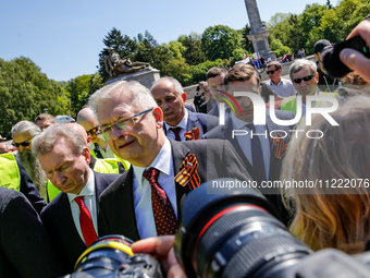 Sergey Andreyev, Russian Ambassador to Poland (C) lays flowers at the Mausoleum of the Soviet Soldiers Cemetery on Russian Victory Day, May...