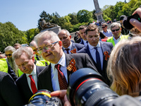 Sergey Andreyev, Russian Ambassador to Poland (C) lays flowers at the Mausoleum of the Soviet Soldiers Cemetery on Russian Victory Day, May...