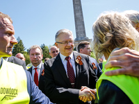 Sergey Andreyev, Russian Ambassador to Poland (C) lays flowers at the Mausoleum of the Soviet Soldiers Cemetery on Russian Victory Day, May...