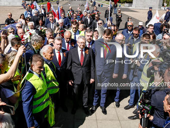 Sergey Andreyev, Russian Ambassador to Poland (C) lays flowers at the Mausoleum of the Soviet Soldiers Cemetery on Russian Victory Day, May...