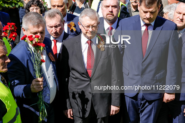 Sergey Andreyev, Russian Ambassador to Poland (C) lays flowers at the Mausoleum of the Soviet Soldiers Cemetery on Russian Victory Day, May...