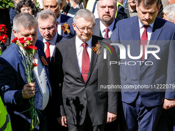 Sergey Andreyev, Russian Ambassador to Poland (C) lays flowers at the Mausoleum of the Soviet Soldiers Cemetery on Russian Victory Day, May...