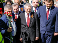 Sergey Andreyev, Russian Ambassador to Poland (C) lays flowers at the Mausoleum of the Soviet Soldiers Cemetery on Russian Victory Day, May...