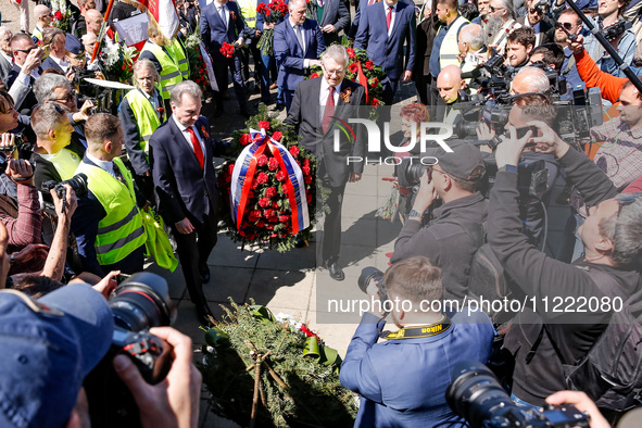 Sergey Andreyev, Russian Ambassador to Poland (C) lays flowers at the Mausoleum of the Soviet Soldiers Cemetery on Russian Victory Day, May...