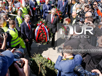 Sergey Andreyev, Russian Ambassador to Poland (C) lays flowers at the Mausoleum of the Soviet Soldiers Cemetery on Russian Victory Day, May...