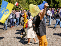 Pro-Ukrain and pro-Russian activists wait for Sergey Andreyev, Russian Ambassador to Poland to arrive to lay flowers at the Mausoleum of the...