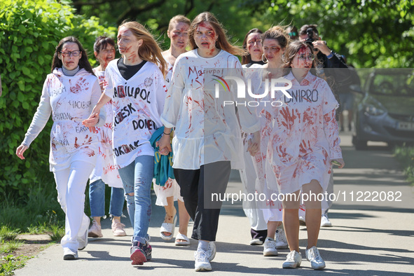 Ukrainian activist wait for Sergey Andreyev, Russian Ambassador to Poland to arrive to lay flowers at the Mausoleum of the Soviet Soldiers C...