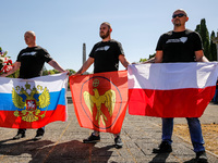 Pro-Russian activists wait for Sergey Andreyev, Russian Ambassador to Poland to arrive to lay flowers at the Mausoleum of the Soviet Soldier...