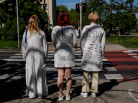 Ukrainian activist wait for Sergey Andreyev, Russian Ambassador to Poland to arrive to lay flowers at the Mausoleum of the Soviet Soldiers C...