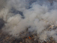 Thick smoke and fire are engulfing the area in Limassol, Cyprus, on May 9, 2024. A wildfire is raging in the Industrial Zone of Ipsonas, a f...