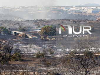 A fire is burning next to an industrial site in Limassol, Cyprus, on May 9, 2024. The wildfire, which broke out in the Industrial Zone of Ip...