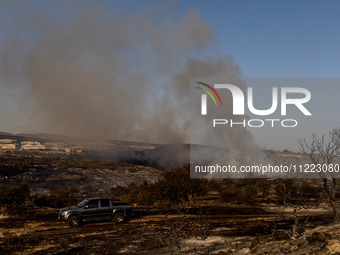 Smoke is rising from a fire in Limassol, Cyprus, on May 9, 2024. The wildfire, which broke out in the Industrial Zone of Ipsonas, a few kilo...