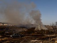 Smoke is rising from a fire in Limassol, Cyprus, on May 9, 2024. The wildfire, which broke out in the Industrial Zone of Ipsonas, a few kilo...