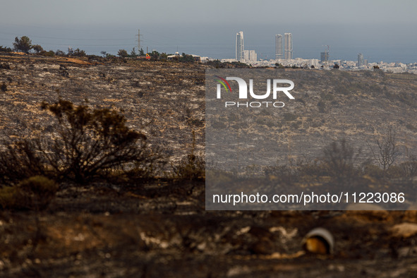 Skyscrapers are being viewed from the site in Limassol, Cyprus, on May 9, 2024. A wildfire is burning at the Industrial Zone of Ipsonas, a f...