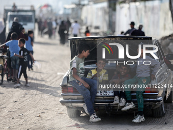 Displaced Palestinians are returning to Khan Yunis in the southern Gaza Strip to set up shelter amid the ongoing conflict between Israel and...