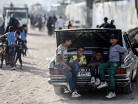 Displaced Palestinians are returning to Khan Yunis in the southern Gaza Strip to set up shelter amid the ongoing conflict between Israel and...