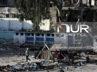 Displaced Palestinians are returning to Khan Yunis in the southern Gaza Strip to set up shelter amid the ongoing conflict between Israel and...