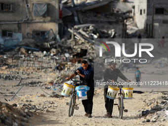 Displaced Palestinians are returning to Khan Yunis in the southern Gaza Strip to set up shelter amid the ongoing conflict between Israel and...