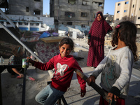 Displaced Palestinians are returning to Khan Yunis in the southern Gaza Strip to set up shelter amid the ongoing conflict between Israel and...