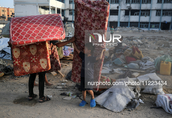 Displaced Palestinians are returning to Khan Yunis in the southern Gaza Strip to set up shelter amid the ongoing conflict between Israel and...