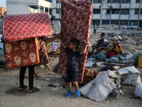 Displaced Palestinians are returning to Khan Yunis in the southern Gaza Strip to set up shelter amid the ongoing conflict between Israel and...