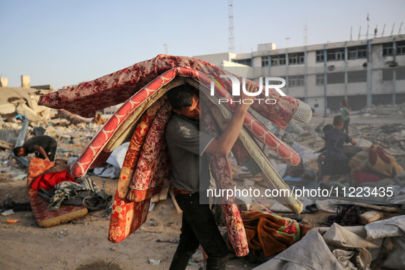 Displaced Palestinians are returning to Khan Yunis in the southern Gaza Strip to set up shelter amid the ongoing conflict between Israel and...