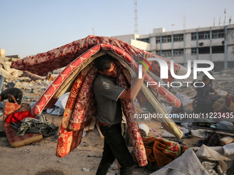 Displaced Palestinians are returning to Khan Yunis in the southern Gaza Strip to set up shelter amid the ongoing conflict between Israel and...