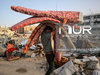 Displaced Palestinians are returning to Khan Yunis in the southern Gaza Strip to set up shelter amid the ongoing conflict between Israel and...