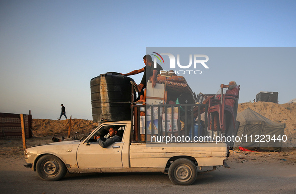 Displaced Palestinians are arriving in a truck carrying their belongings to set up shelter after returning to Khan Yunis in the southern Gaz...