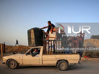 Displaced Palestinians are arriving in a truck carrying their belongings to set up shelter after returning to Khan Yunis in the southern Gaz...