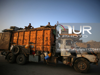 Displaced Palestinians are arriving in a truck carrying their belongings to set up shelter after returning to Khan Yunis in the southern Gaz...