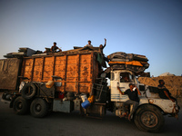 Displaced Palestinians are arriving in a truck carrying their belongings to set up shelter after returning to Khan Yunis in the southern Gaz...