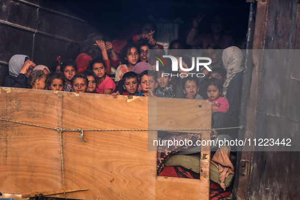 Displaced Palestinians are arriving in a truck carrying their belongings to set up shelter after returning to Khan Yunis in the southern Gaz...