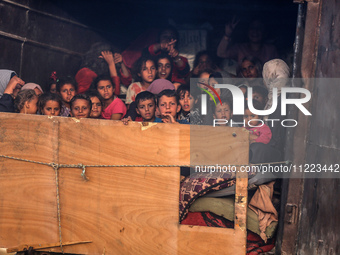 Displaced Palestinians are arriving in a truck carrying their belongings to set up shelter after returning to Khan Yunis in the southern Gaz...