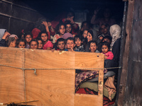 Displaced Palestinians are arriving in a truck carrying their belongings to set up shelter after returning to Khan Yunis in the southern Gaz...