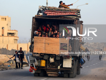 Displaced Palestinians are arriving in a truck carrying their belongings to set up shelter after returning to Khan Yunis in the southern Gaz...