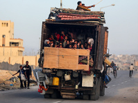 Displaced Palestinians are arriving in a truck carrying their belongings to set up shelter after returning to Khan Yunis in the southern Gaz...