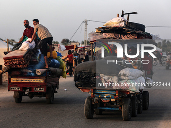 Displaced Palestinians are returning to Khan Yunis in the southern Gaza Strip to set up shelter amid the ongoing conflict between Israel and...