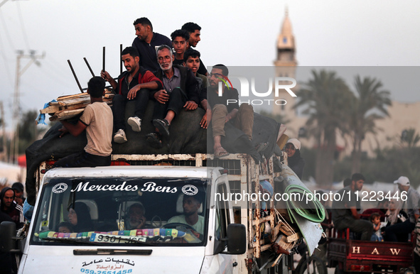 Displaced Palestinians are arriving in a truck carrying their belongings to set up shelter after returning to Khan Yunis in the southern Gaz...