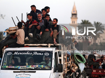 Displaced Palestinians are arriving in a truck carrying their belongings to set up shelter after returning to Khan Yunis in the southern Gaz...