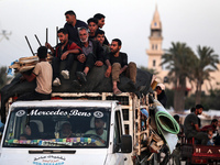 Displaced Palestinians are arriving in a truck carrying their belongings to set up shelter after returning to Khan Yunis in the southern Gaz...