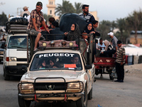 Displaced Palestinians are arriving in a truck carrying their belongings to set up shelter after returning to Khan Yunis in the southern Gaz...