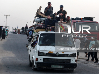 Displaced Palestinians are arriving in a truck carrying their belongings to set up shelter after returning to Khan Yunis in the southern Gaz...