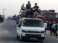 Displaced Palestinians are arriving in a truck carrying their belongings to set up shelter after returning to Khan Yunis in the southern Gaz...