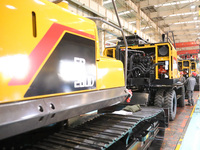 Workers are working on the production line at LOVOL Co in Qingdao, Shandong Province, China, on May 9, 2024. (