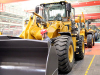 Workers are working on the production line at LOVOL Co in Qingdao, Shandong Province, China, on May 9, 2024. (