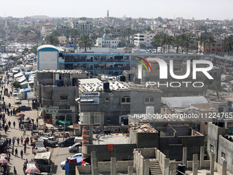 Tents housing internally displaced Palestinians are crowding the beach and the Mediterranean shoreline in Deir el-Balah in the central Gaza...