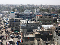 Tents housing internally displaced Palestinians are crowding the beach and the Mediterranean shoreline in Deir el-Balah in the central Gaza...