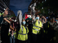 Pro-Palestinian students rally outside the office of George Washington University president Ellen Granberg, Washington, DC, May 9, 2024.  Th...