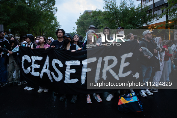 Pro-Palestinian students rally outside the office of George Washington University President Ellen Granberg, Washjngton, DC, May 9, 2024.  Po...